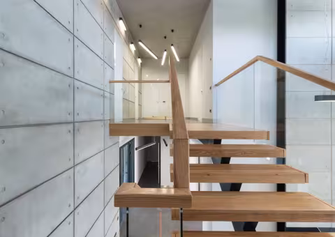 Custom floating staircase installation in Vaughan — wall-mounted steel stringers with oak treads by AC Brothers GTA