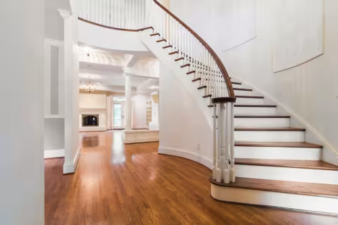 Staircase refinished to match new hardwood floors across the GTA — precision colour matching by AC Brothers