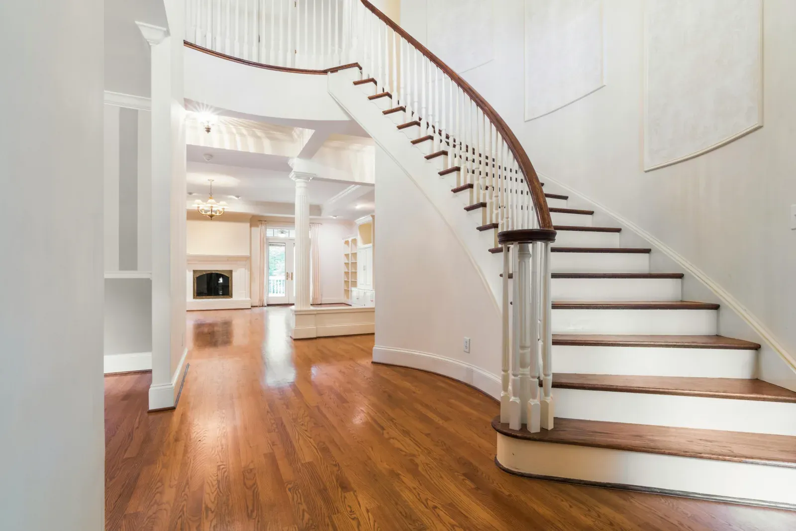 Staircase refinished to match new hardwood floors across the GTA — precision colour matching by AC Brothers