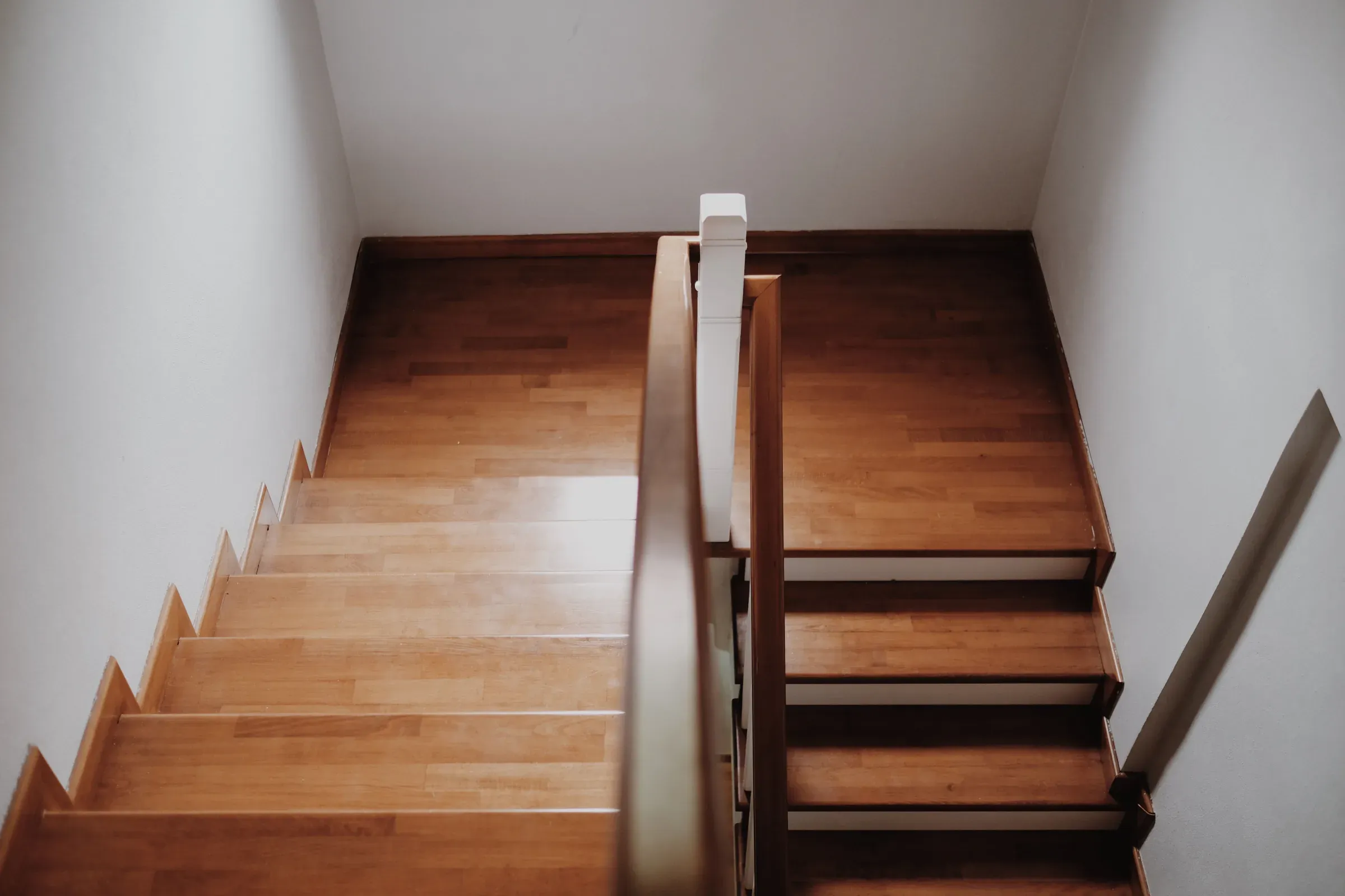 Staircase refinishing completed by AC Brothers in the GTA — hardwood stairs sanded and restained