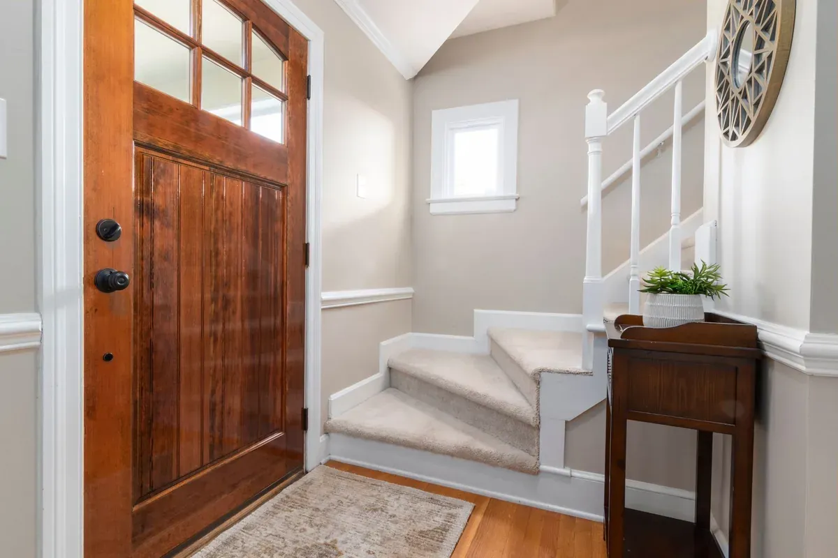 Staircase refinishing Oakville — freshly refinished hardwood staircase by AC Brothers in an Oakville home